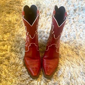 Red Ariat Boots worn a two times in rodeo season. Unique white trim retro look.